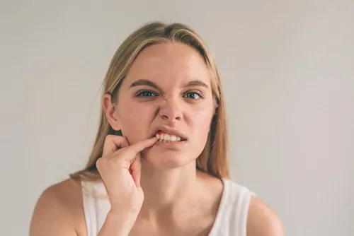 woman with gum pain