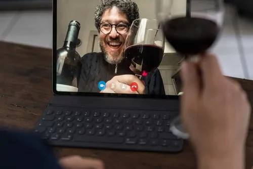 zoom call with glass of red wine